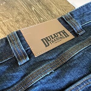 Duluth Trading Co Blue and Brown Jeans with Leather Patch